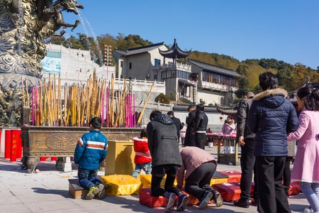 JIANGYIN, China in 2015 February 19: people burn incense at the first day of the Chinese new year to the temple to burn incense and pray, the year of the sheep, in February 19, began.のeditorial素材