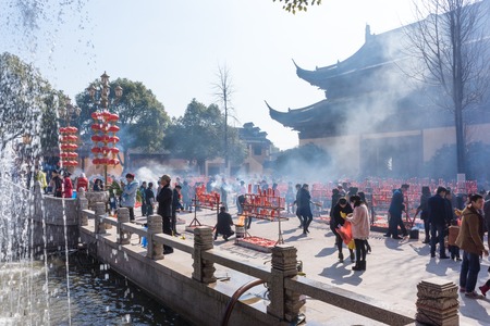 JIANGYIN, China in 2015 February 19: people burn incense at the first day of the Chinese new year to the temple to burn incense and pray, the year of the sheep, in February 19, began.のeditorial素材