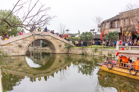 XITANG, CHINA - SEP 16: people walking at Xitang ancient town on Sep 16, 2013 , Xitang is first batch of Chinese historical and cultural town, located in Zhejiang Province, China.のeditorial素材