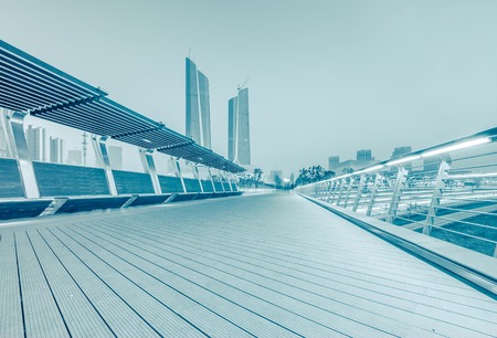modern square with skyline and cityscape backgroundの写真素材