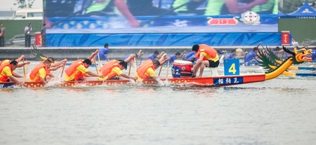 In June 11, 2013, a dragon boat race was underway in Jiangyin, Jiangsu Province, China. The dragon...