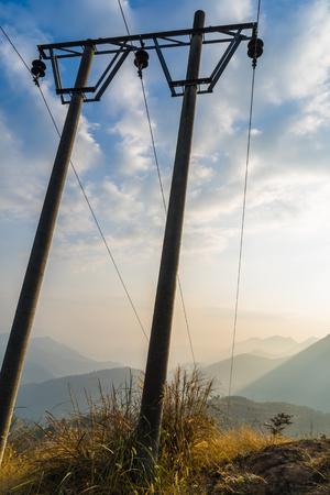 Low Angle View Of telegraph poles against blue sky.の写真素材