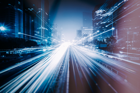 blurred traffic light trails on road at night in China.のeditorial素材