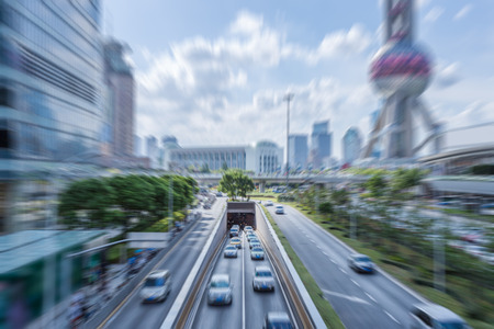 Traffic On Road In Shanghai with cityscape in background.の写真素材