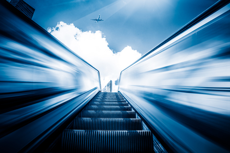 Escalator in an underground station with skyline in background.のeditorial素材