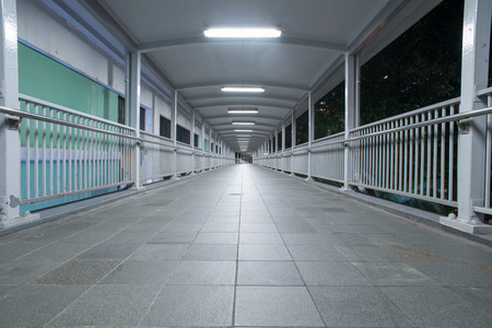 view of footbridge at night in Hong Kong,China.の写真素材