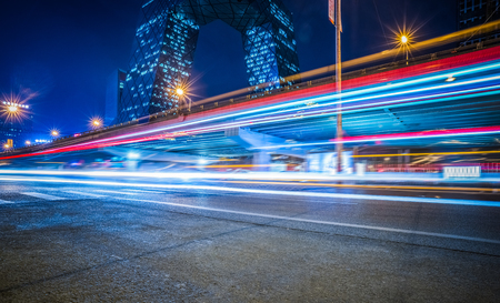 blurred traffic light trails on road at night in China.のeditorial素材