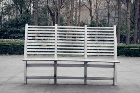 empty bench on pavement in city of China.の写真素材