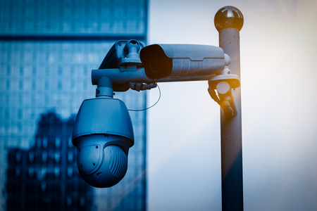 CCTV security camera front of a building in city of China.