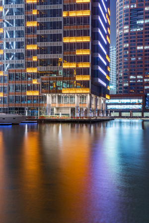 buildings standing by riverside under dramatic sky in Nanchang,China.のeditorial素材