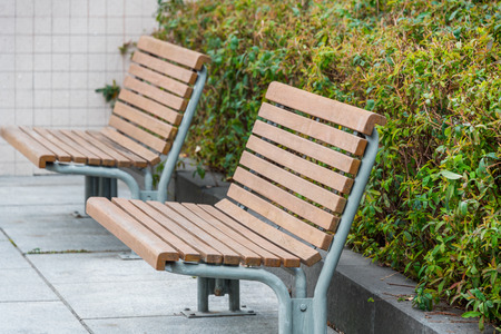 Bench in a park on sunny day in city of China.