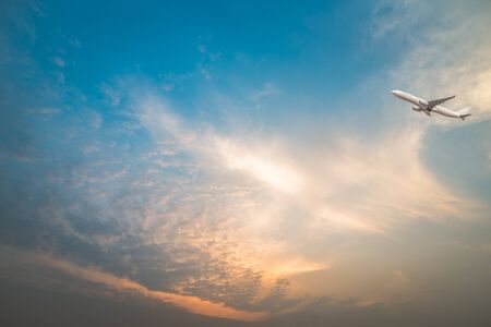 full frame shot of  cloudscape with a plane flying over.