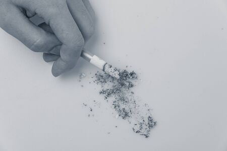 Close-Up Of Man Hand Holding Cigarette.の写真素材