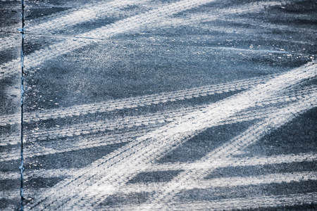 Full frame shot of white arrow symbol on road.