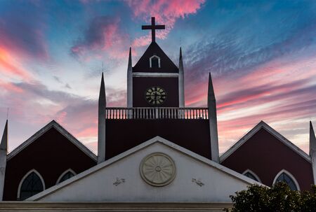 church roof against dramatic sky during sunset in city of China.の写真素材