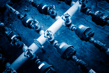 steel pipelines and valves in a plant,Industrial zone.
