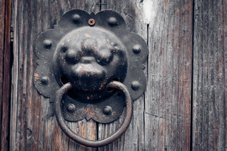 closeup of the antique oriental door knocker,Lishui city,china.