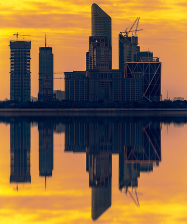 Silhouette of cityscape along riverside.の写真素材
