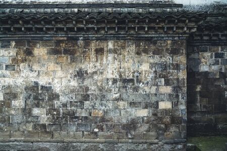 detail shot of stone wall in an old traditional village of China.の写真素材