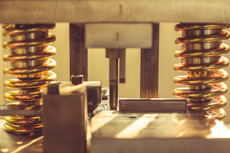 closeup of metal spiral springs of machinery in factory.の写真素材