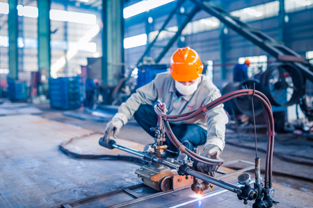 Worker doing electric welding,factory manufacturing,industry concepts.のeditorial素材