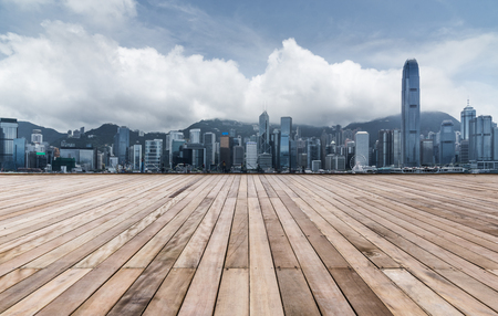 empty wooden platform with Shanghai skyline in background.の写真素材