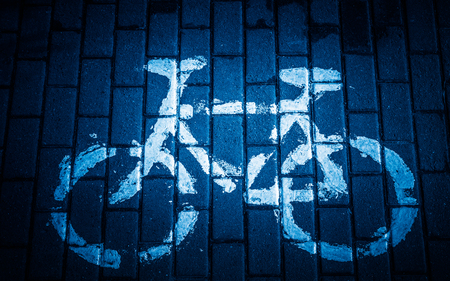 high angle view of bicycle symbol on street.の写真素材