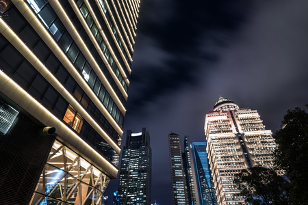 Skyscrapers from a low angle view at night in Shanghai,China.の写真素材