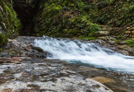 Stream Flowing Through Rocks in forest.の写真素材