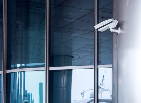 detail shot of CCTV security camera hanging on column