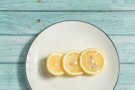 Lemon   in plate on  the blue table