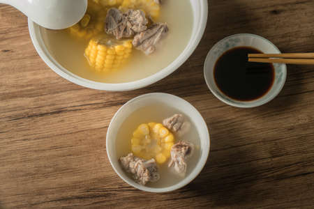 Corn and pork bone soup, delicious Chinese food. The decorations on the dining table.の写真素材