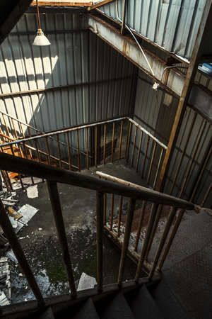 The abandoned industrial building. Fantasy interior scene. Shot in an abandoned ruin.の写真素材