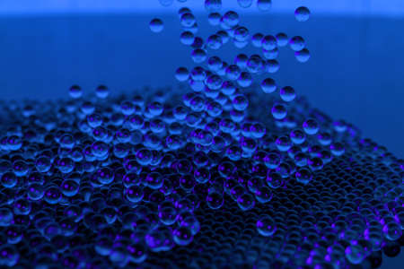 A mass of spheres falling down from above, 3d rendering. Computer digital drawing.の写真素材