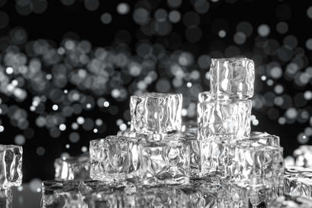 Ice cubes stacked each other with black background, 3d rendering. Computer digital drawing.の写真素材