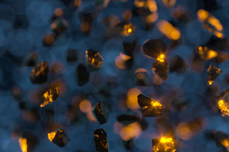 Broken gravels floating on black background, 3d rendering. Computer digital drawing.の写真素材