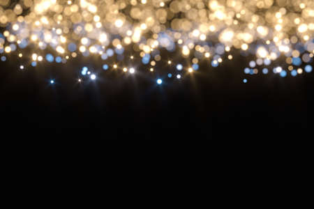 Floating specks of light on black background, 3d rendering. Computer digital drawing.の写真素材