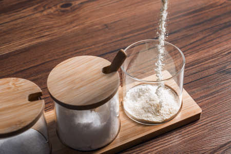 Condiments in the glass bottle on wooden table, still life photographyの写真素材