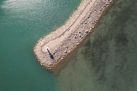 Road and lighthouses on the lake. Shot in Sayram Lake, Xinjiang, China.