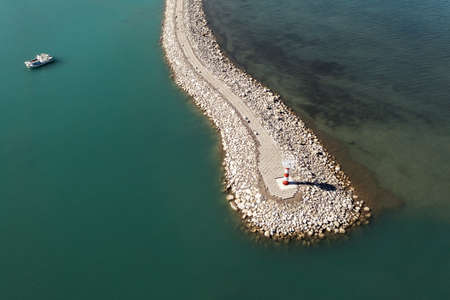 Road and lighthouses on the lake. Shot in Sayram Lake, Xinjiang, China.