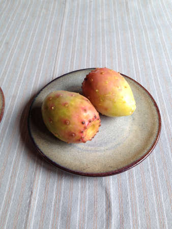 Two on the white porcelain plate ginseng fruit, fruit Yunnanの写真素材