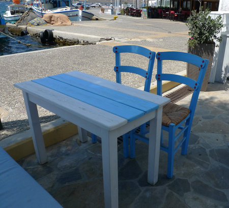 Table and chairs in Panteli beach, Leros, Greeceの写真素材