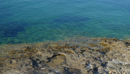 rocky coast of the Mediterranean Sea with transparent water, natural backgroundの写真素材