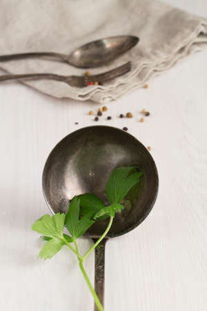 old fork ,spoon and ladle on a white backgroundの写真素材