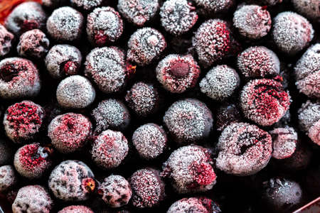 frozen black currant, red currant and cherry. top view. macroの写真素材