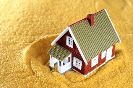 Little cottage and yellow sand.の写真素材