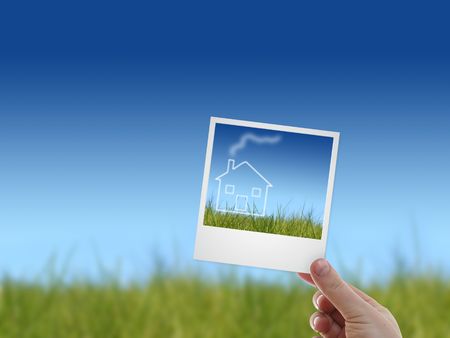 Picture in a hand. Housing concept on the picture.の写真素材