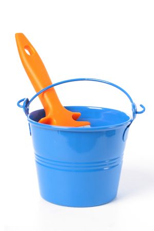 Blue bucket and new orange brush over white.の写真素材
