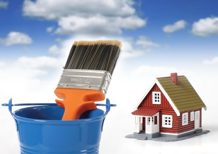 Brush and bucket. House on the background.の写真素材