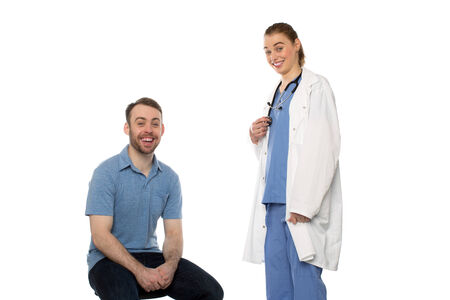 Male Patient and Female Doctor Smiling against white background.の写真素材